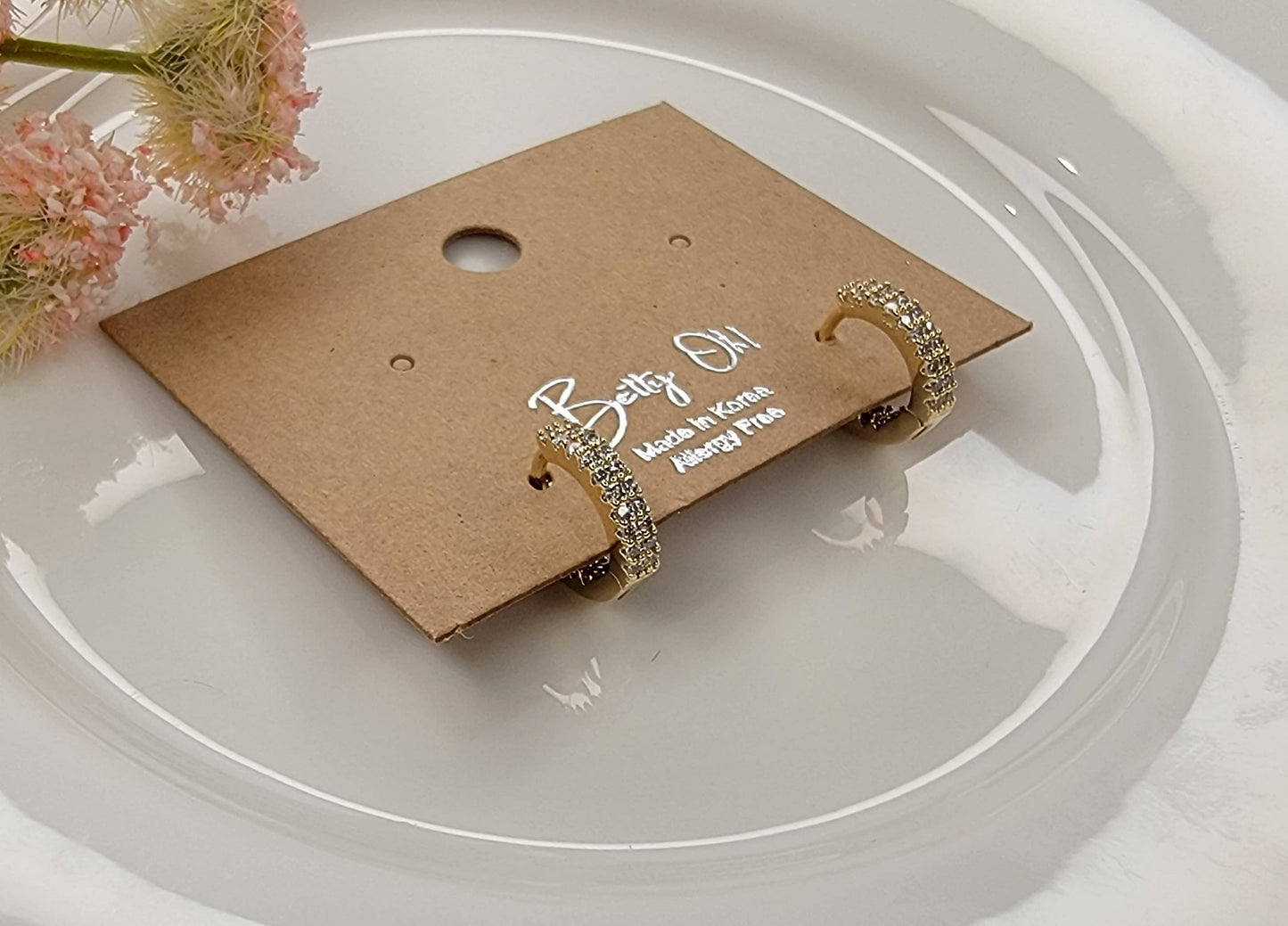 CZ CLICKER EARRINGS.