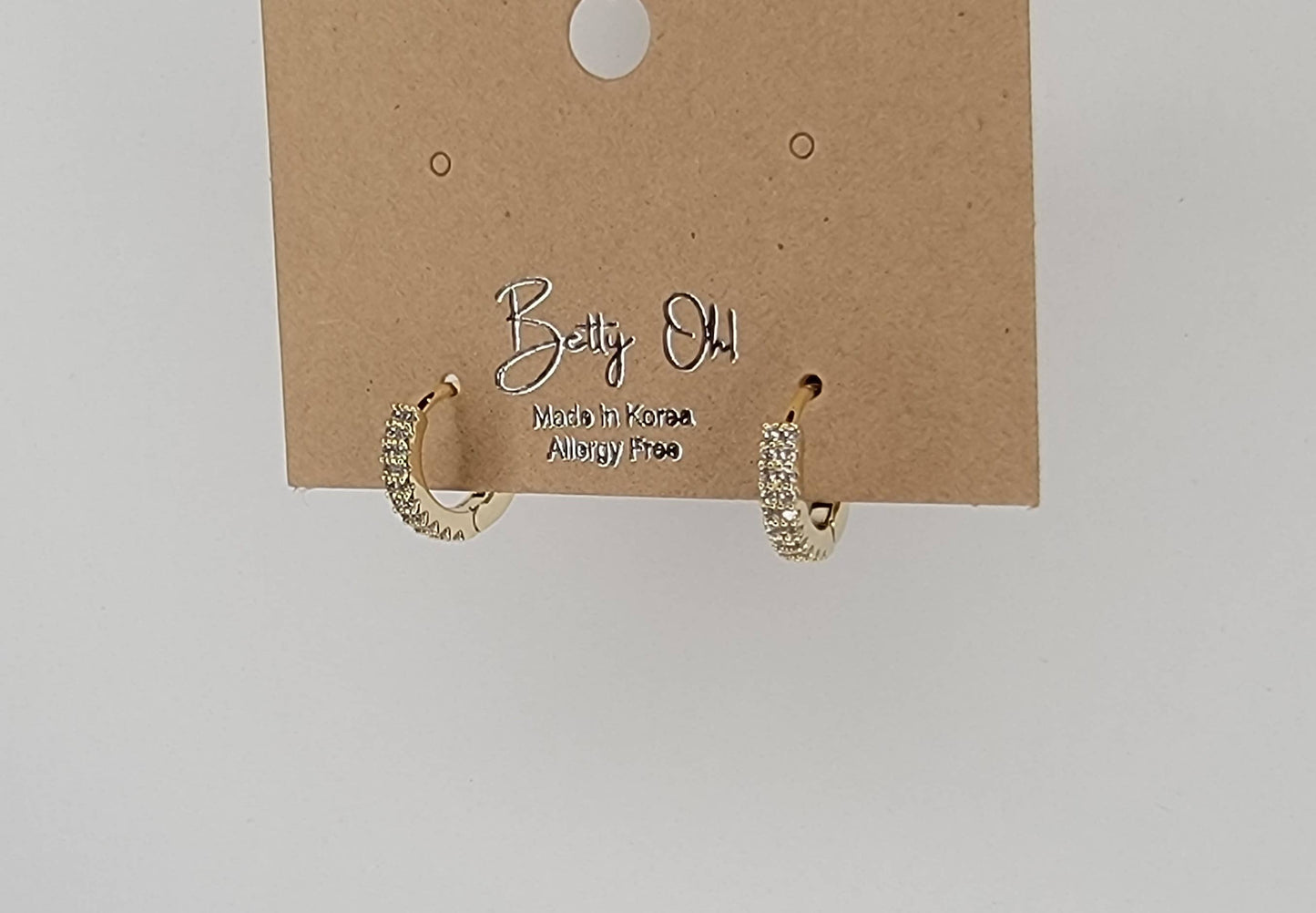 CZ CLICKER EARRINGS.