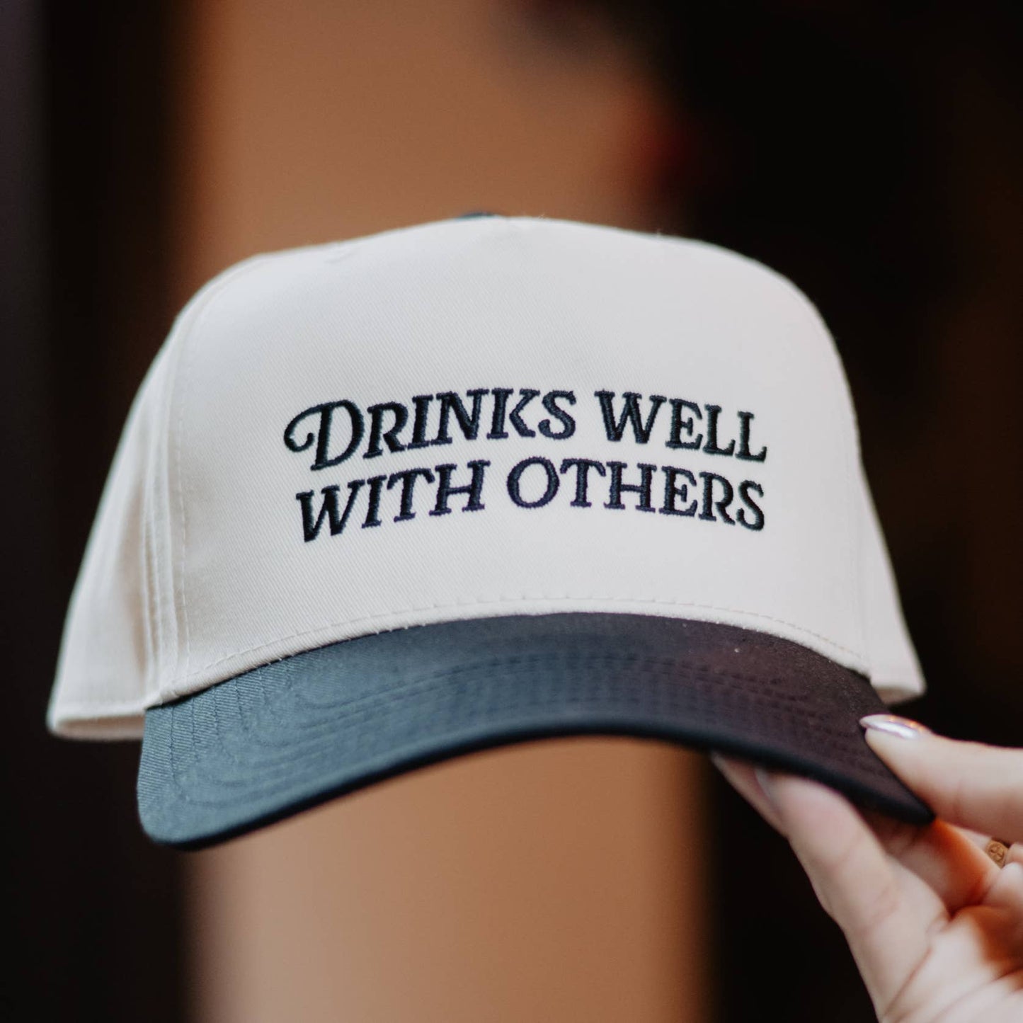 Drinks Well Trucker Hat