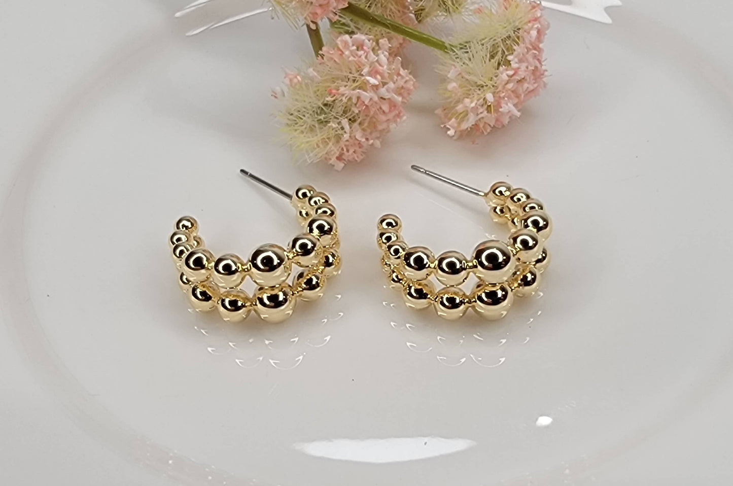 BEADED HOOP EARRINGS.