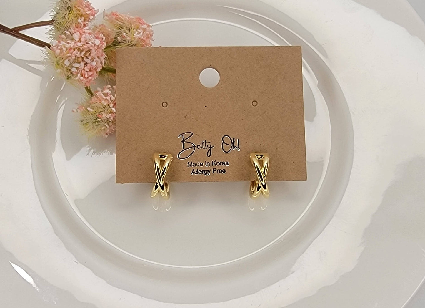 X-CROSS HOOP EARRINGS.