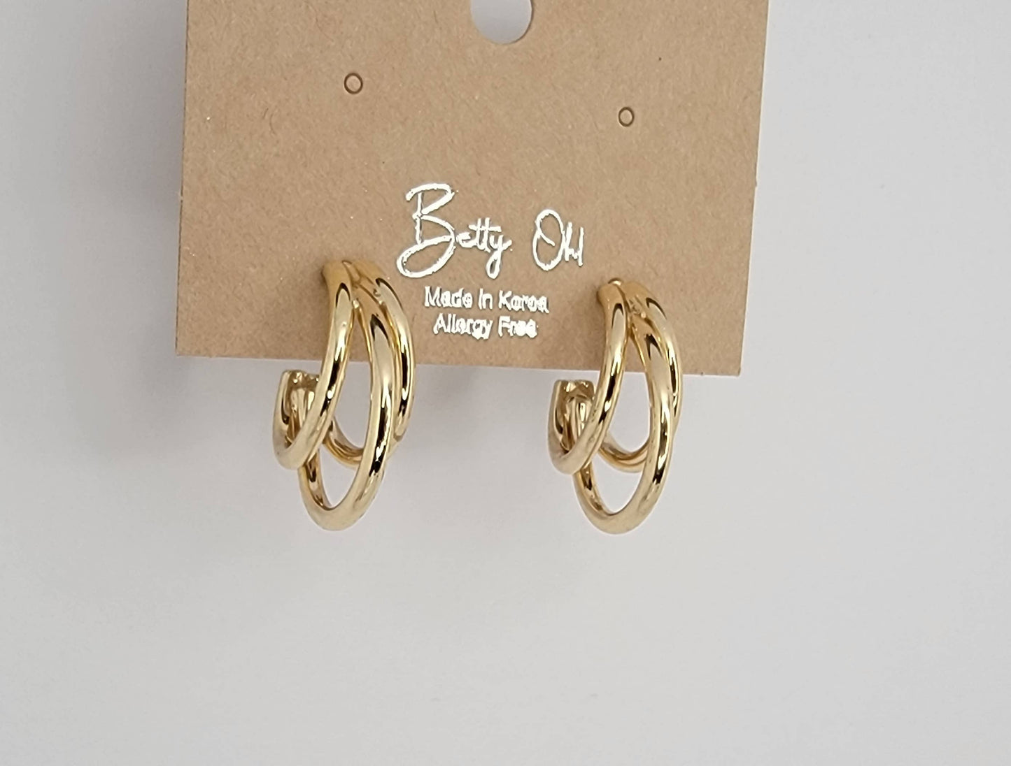 TRIPLE TUBE HOOP EARRINGS.