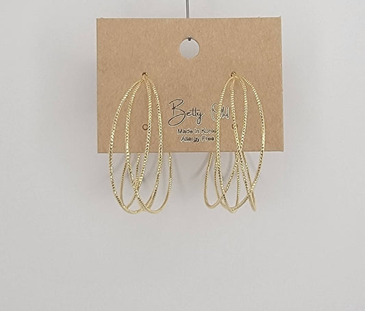 LAZER CUT CRISS CROSS HOOP EARRINGS.