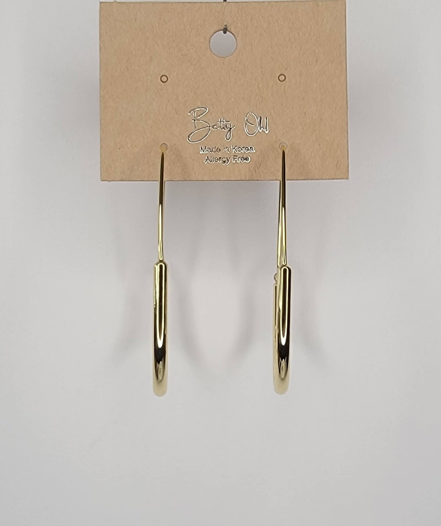 LONG OVAL HOOP EARRINGS.