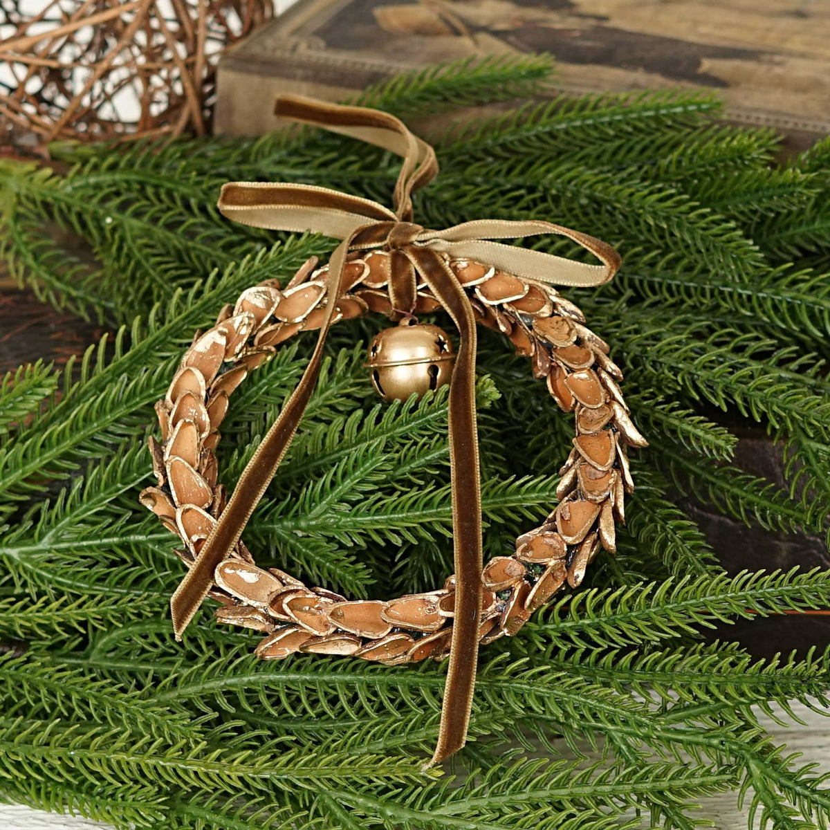 571037- 4.5inD Nut Shell Ring with Gold Bell and Brown ribbo